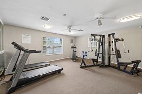 Sanford apartment for rent - A gym with treadmills, elliptical machines, and other exercise equipment.