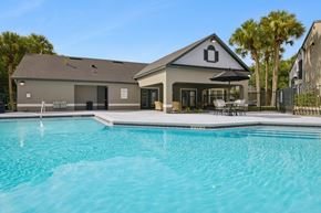 Sanford apartment for rent - A house with a pool in front of it.