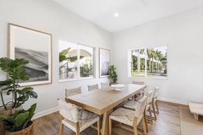 Davie apartment for rent - a dining room with a wooden table and chairs