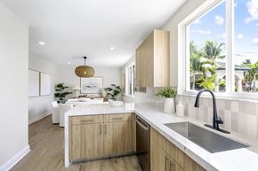Davie apartment for rent - a kitchen with wooden cabinets and a large window