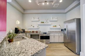 Morrisville apartment for rent - A kitchen with a granite countertop and stainless steel appliances.
