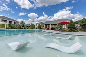 Morrisville apartment for rent - A swimming pool with a white sculpture in the middle of it.