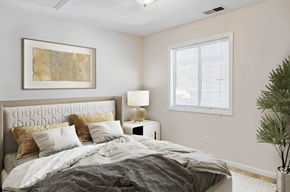 Spring Lake apartment for rent - a bedroom with a bed and a window at Patriot Point Apartment Homes, North Carolina 