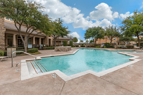 Dallas apartment for rent - Swimming pool with lounge seating and community clubhouse