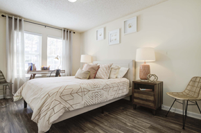Wilmington apartment for rent - A bedroom with a large bed and a chair.