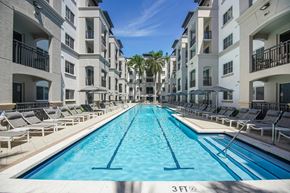 South Miami apartment for rent - A swimming pool in front of apartment buildings.