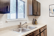 Raleigh apartment for rent - A kitchen with a sink and a window at Regency Park Apartment Homes, Raleigh