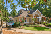 Raleigh apartment for rent - A house with a pool in the backyard at Regency Park Apartment Homes, Raleigh, NC