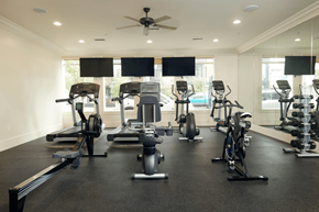 Salt Lake City apartment for rent - a gym with treadmills and weights on the floor