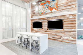 Durham apartment for rent - a dining room with a white table and chairs and a television on the wall