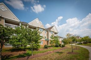Waldorf apartment for rent - a row of townhomes with trees in front of them