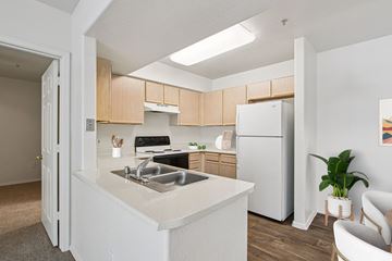 Mesa apartment for rent - A kitchen with a white counter top and a white refrigerator.
