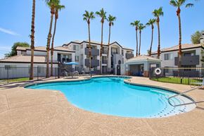 Mesa apartment for rent - swimming pool with designed walls at The Village at Sun Valley Apartments, Arizona