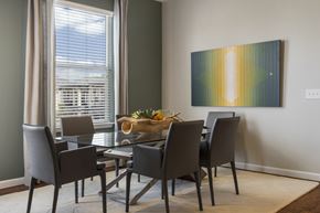 Pflugerville apartment for rent - A dining room with a table set for four.