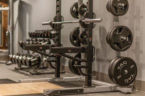 Nashville apartment for rent - A weightlifting bar with weights on it in a gym.