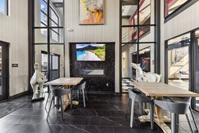 Louisville apartment for rent - A modern dining room with a wooden table and chairs.