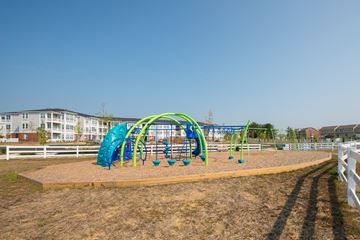 Waldorf apartment for rent - A playground with a green and blue slide.