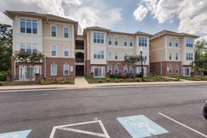 Waldorf apartment for rent - a row of three story apartment buildings on a city street