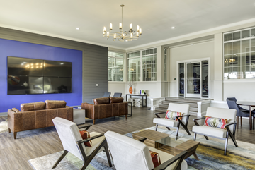 Lexington apartment for rent - A living room with a brown couch and a white chair.