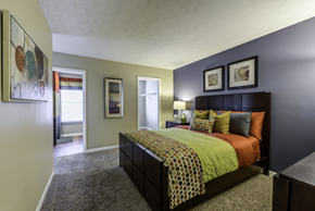Lexington apartment for rent - Carpeted bedroom with doorways leading to the closet, bathroom and living room.