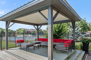 Lexington apartment for rent - Outdoor pergola with lounge seating overlooking the community tennis courts