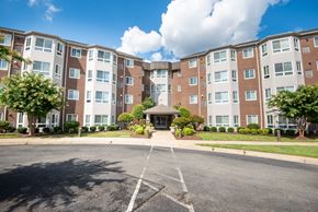 Waldorf apartment for rent - a large apartment building with a street in front of it