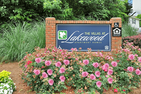 Atlanta apartment for rent - Community Sign for The Villas at Lakewood Apartment Homes surrounded by flowers and ferns.
