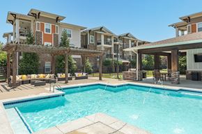 Murfreesboro apartment for rent - A swimming pool in front of apartment buildings.