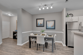 Morrisville apartment for rent - A dining room with a table set for two and a potted plant on the table.
