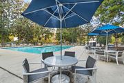 Cary apartment for rent - Poolside Relaxing Chairs at Woodlyn on the Green Apartment Homes, Cary, NC, 27513