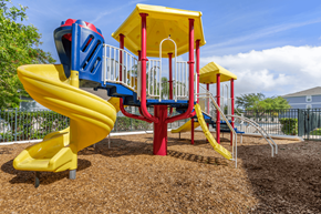 St Petersburg apartment for rent - a playground with a yellow slide and a red and blue slide