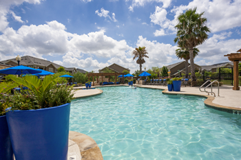 Resort-style swimming pool with sundeck