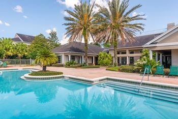 Lakeside pool and wading pool with sundeck seating