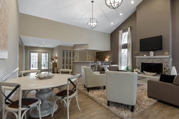 Montgomery Village apartment for rent - a living room with a table and chairs and a fireplace