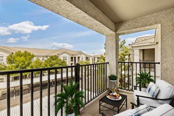 Furnished balcony overlooking residential community