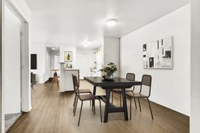 Mesa apartment for rent - Dining room with black table and modern artwork at Tierra Antigua Apartments, Mesa, AZ 85207