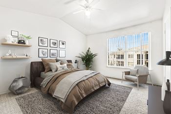 Bedroom with wooden headboard and framed wall art