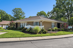 Waldorf apartment for rent - A house with a white picket fence and a green lawn.
