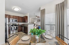 Austin apartment for rent - A modern kitchen with a dining table set for two.