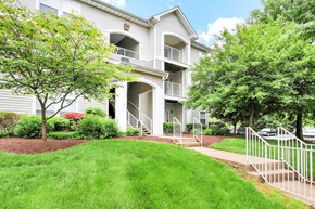 Warrenton apartment for rent - A white two-story apartment building with a balcony on the second floor.