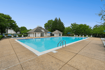 Swimming pool with tanning deck