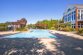 Atlanta apartment for rent - a swimming pool with a blue building in the background