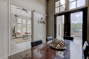 Atlanta apartment for rent - a dining area with a wooden table and black leather chairs