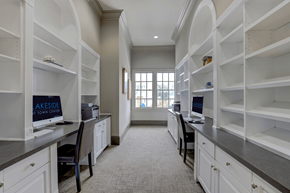 Atlanta apartment for rent - a home office with white cabinets and a window