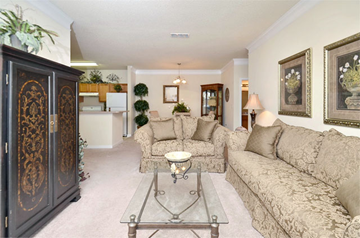 Buford apartment for rent - A living room with a beige couch and a coffee table.