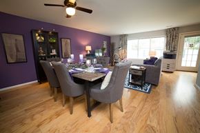 Stafford apartment for rent - Dining room with large dining table with ceiling fan and living room in the background.