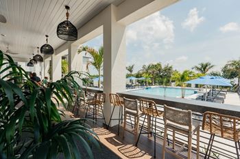 Outdoor pavilion with tv's, summer kitchen, pizza oven, and outdoor games