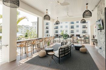 Outdoor pavilion with tv's, summer kitchen, pizza oven, and outdoor games