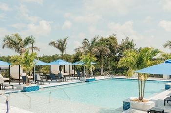 Resort style swimming pool with cabanas