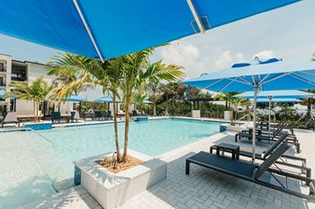 Resort style swimming pool with cabanas